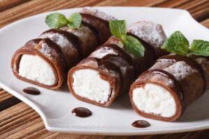 Receta de Crepes de chocolate rellenos de ricotta